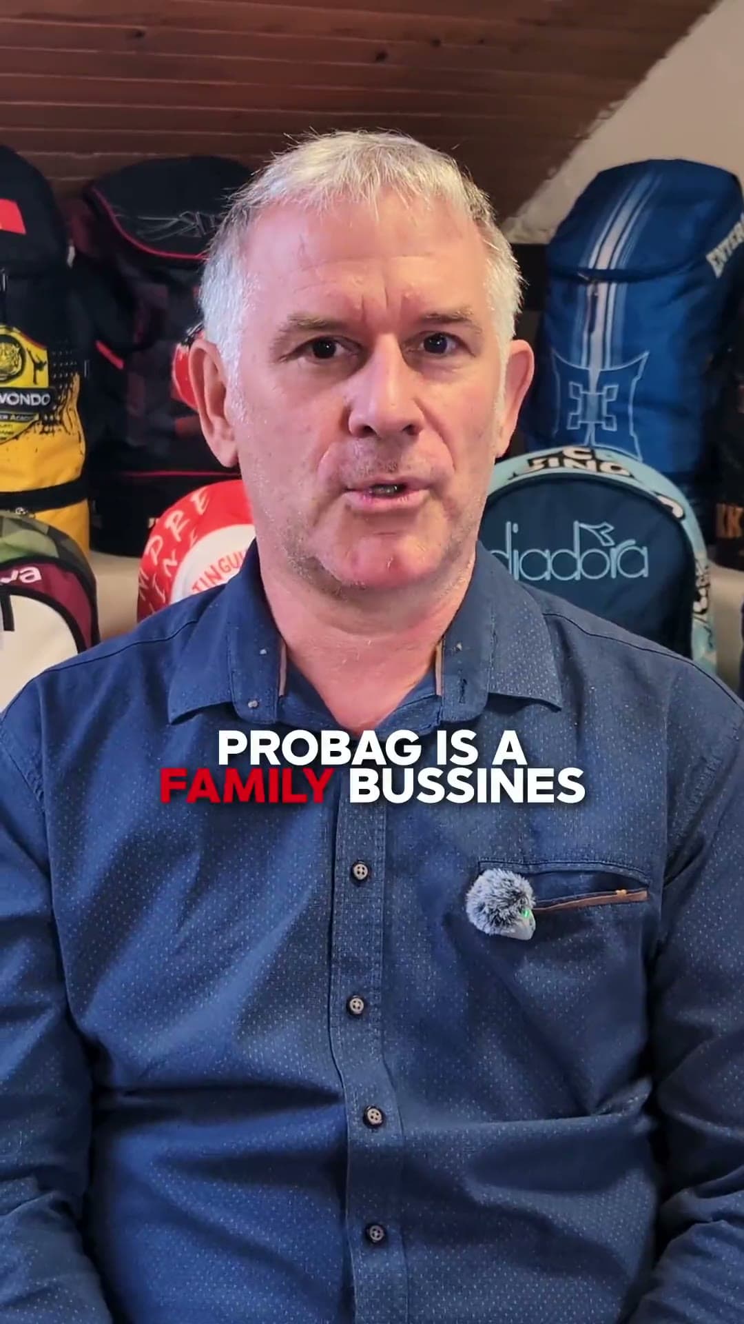 Pro-Bag founder talking about the family business, custom backpacks behind him